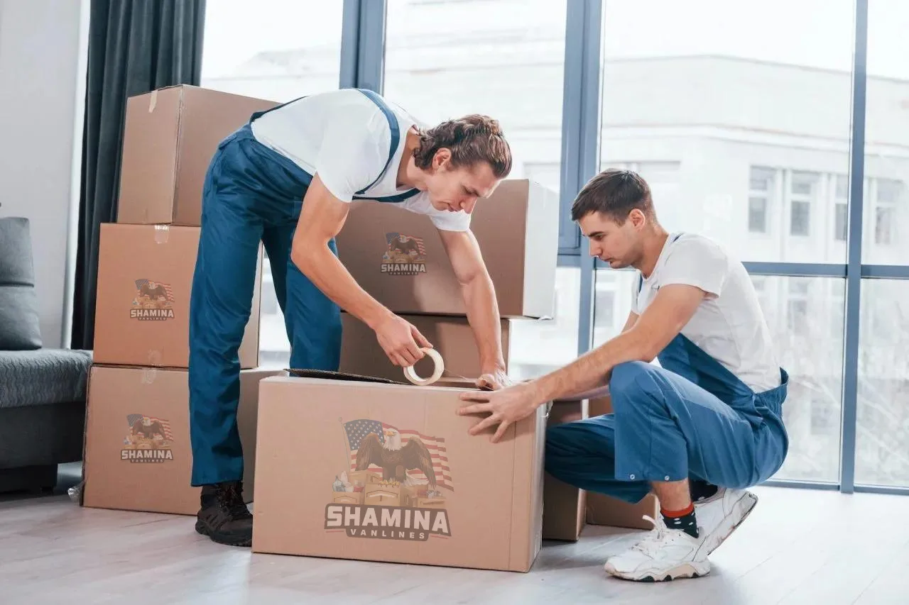 Shamina Vanlines crew packing branded boxes